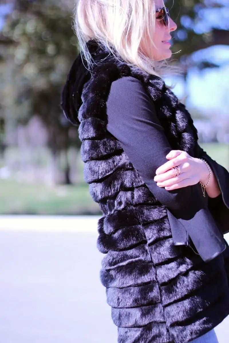 culotte jeans by olivia palmero from the nordstrom, chelsea 28 collaboration paired with tall black suede boots, a chicwish faux fur, hooded vest and a bell sleeve black top