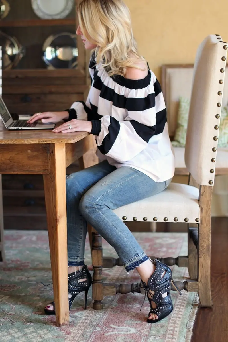 erin busbee of busbeestyle wearing an MLM label off shoulder top and skinny cropped jeans by citizens of humanity with gorjana necklace