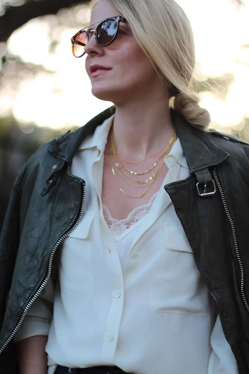 green leather moto jacket by doma paired with equipment slim signature blouse and rag & bone skinny jeans, a gorjana layered gold necklace and python booties