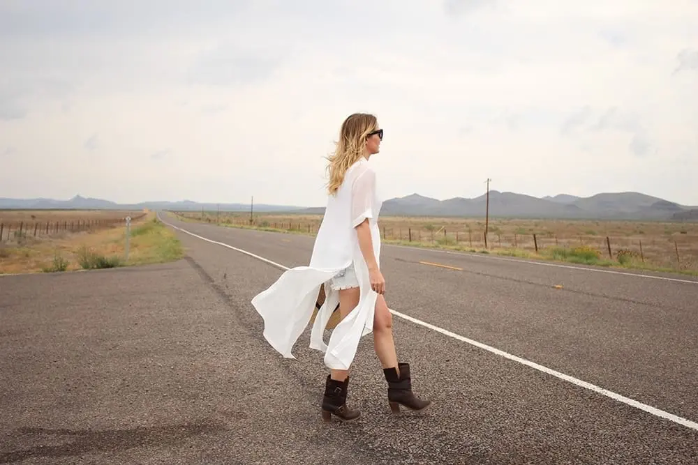 maxi shirt, denim cutoff shorts by BLANK NYC, cowboy hat and white tank with brown buckle moto boots
