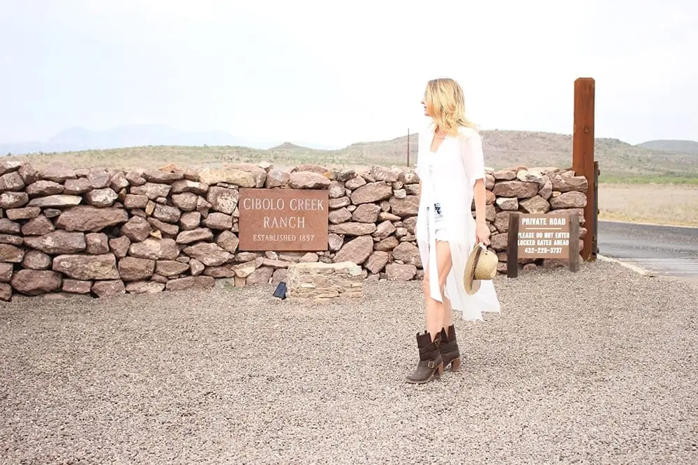maxi shirt, denim cutoff shorts by BLANK NYC, cowboy hat and white tank with brown buckle moto boots