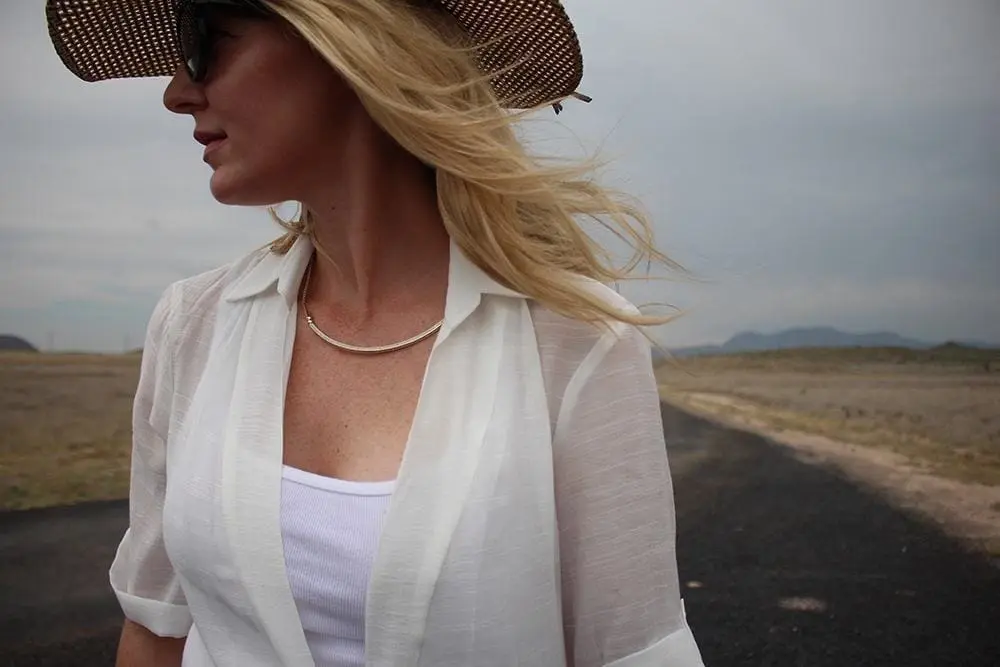 maxi shirt from Asos, denim cutoff shorts by BLANK NYC, cowboy hat and white tank with brown buckle moto boots