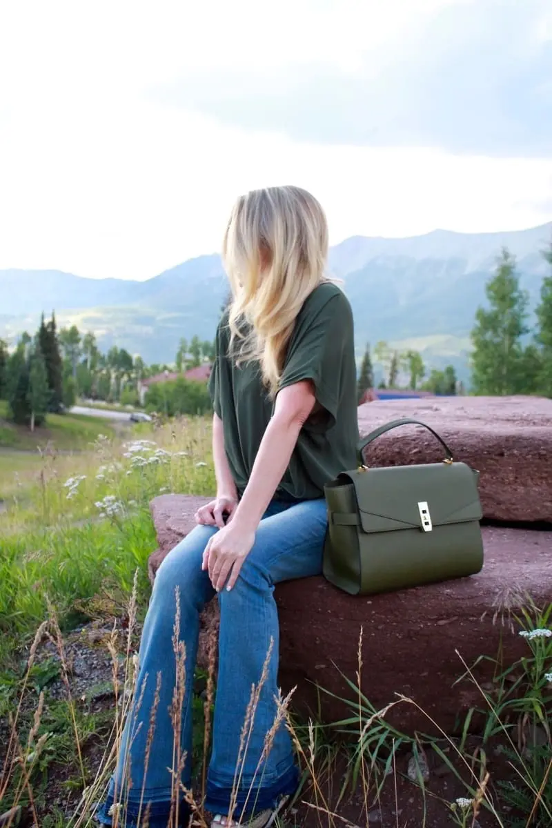 Green Handbag, dark green, army green, uptown satchel, top handle bag, flared jeans, v-neck blouse, green top, round sunglasses
