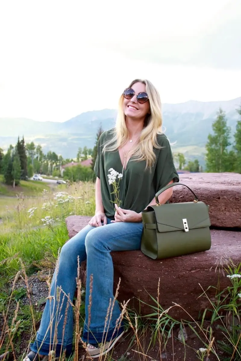 Green Handbag, dark green, army green, uptown satchel, top handle bag, flared jeans, v-neck blouse, green top, round sunglasses