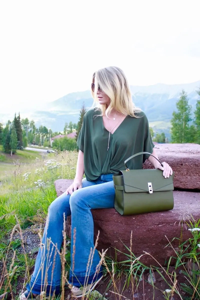 Green Handbag, dark green, army green, uptown satchel, top handle bag, flared jeans, v-neck blouse, green top, round sunglasses
