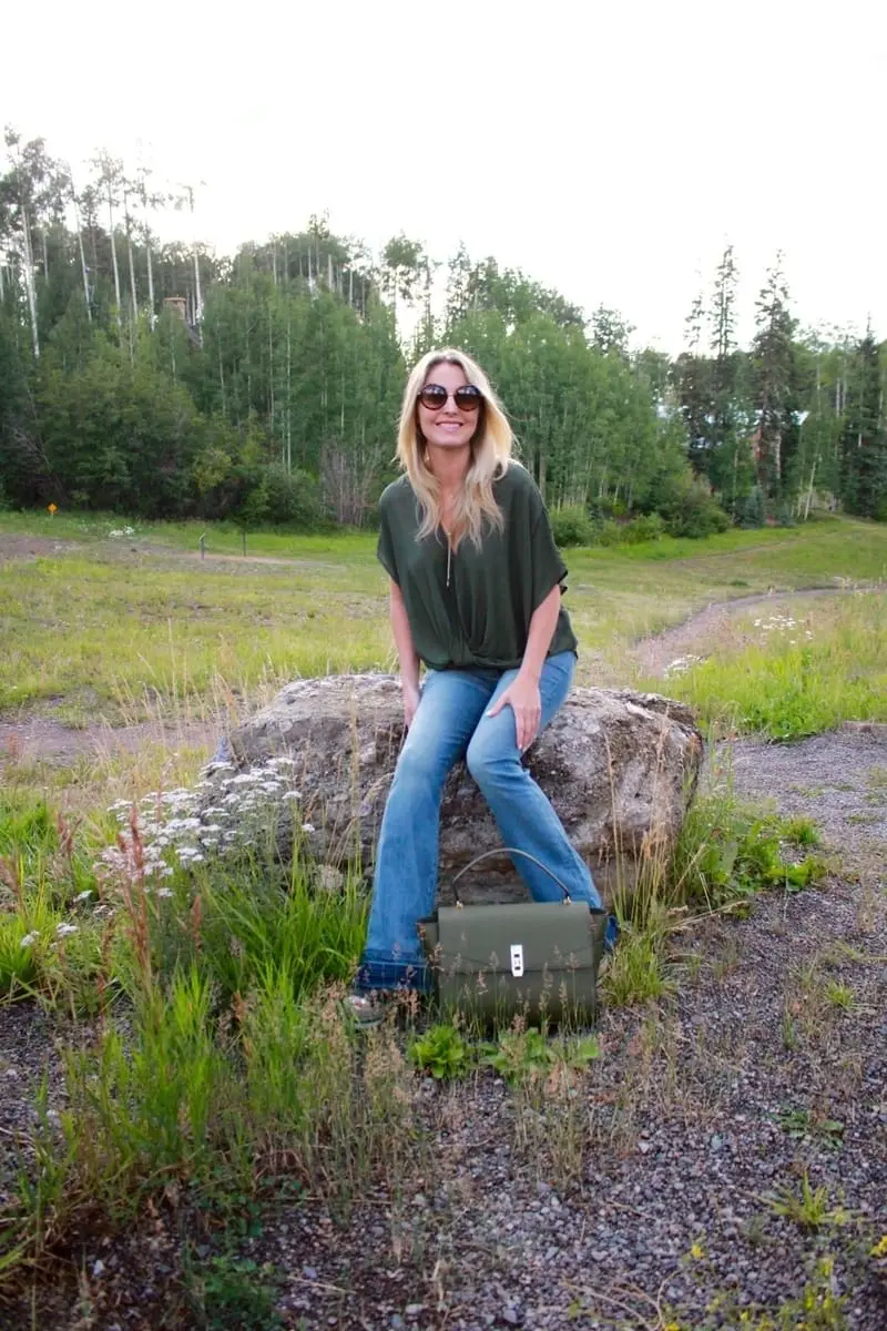 Green Handbag, dark green, army green, uptown satchel, top handle bag, flared jeans, v-neck blouse, green top, round sunglasses