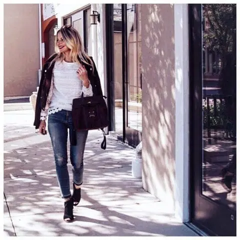 Lace white top with a suede burgundy moto jacket, distressed, high rise skinny jeans and black ankle booties