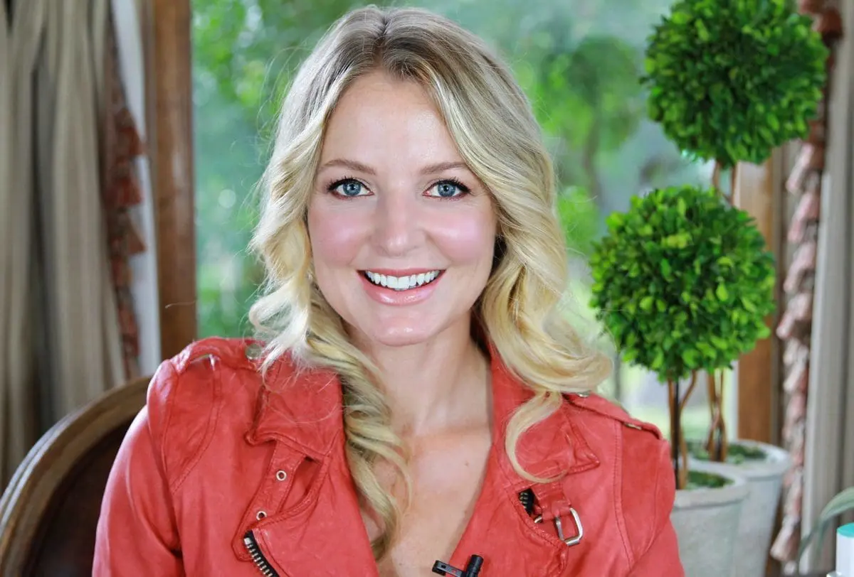erin-busbee-smiling-wearing-red-leather-doma-leather-jacket