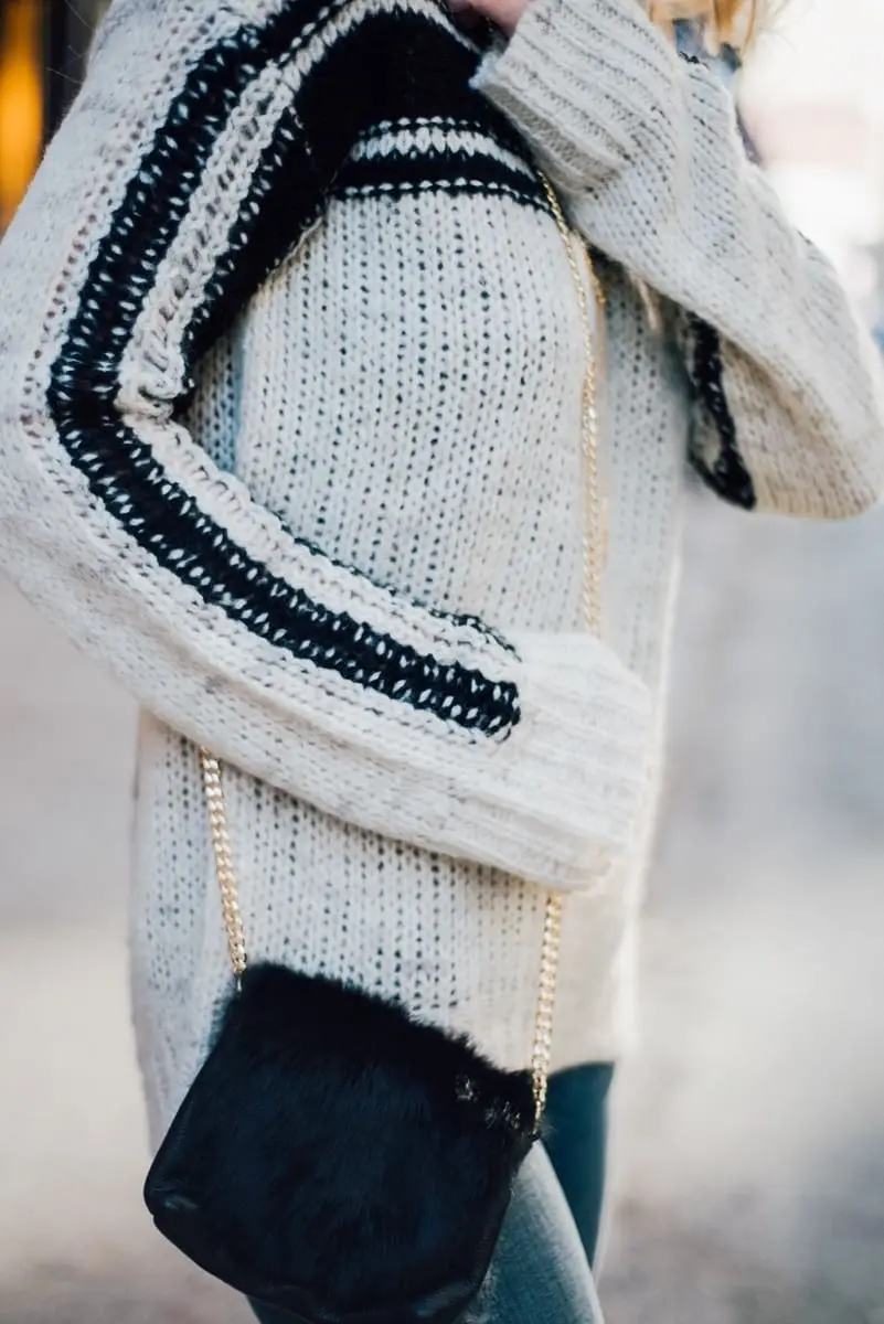 chic and elegant fur crossbody bag from neiman marcus last call with a pam and gela black and white turtleneck sweater