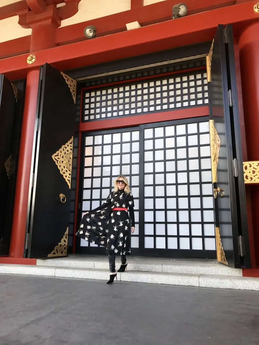 erin busbee at senso ji temple in tokyo japan wearing topshop floral print dress over citizens of humanity coated rocket skinny jeans with marc fisher mules and a halogen black turtleneck from nordstrom
