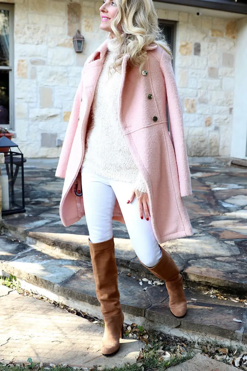 boucle pink coat with fuzzy pink sweater, paired with white jeans and suede scrunchy sam edelman boots 