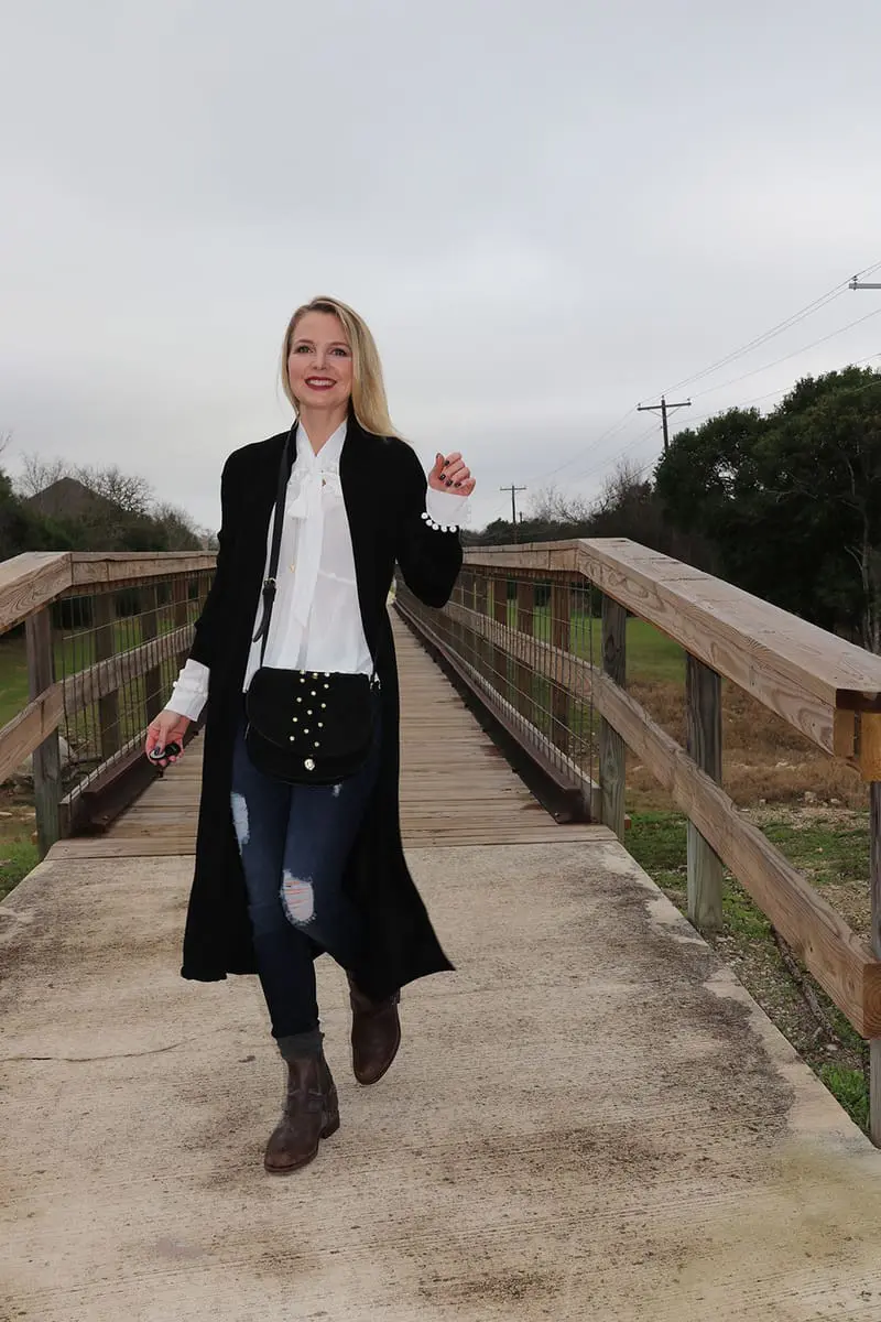 Long black duster cardigan from neiman marcus last call with dark wash skinny jeans slightly distressed by hudson and a white bow blouse by nicole miller
