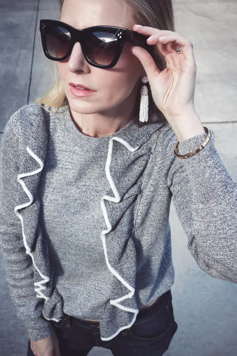 Sunglasses from nordstrom juniors department with UV protection look just like Celine but for a lot less! paired with a ruffle sweater by Topshop 