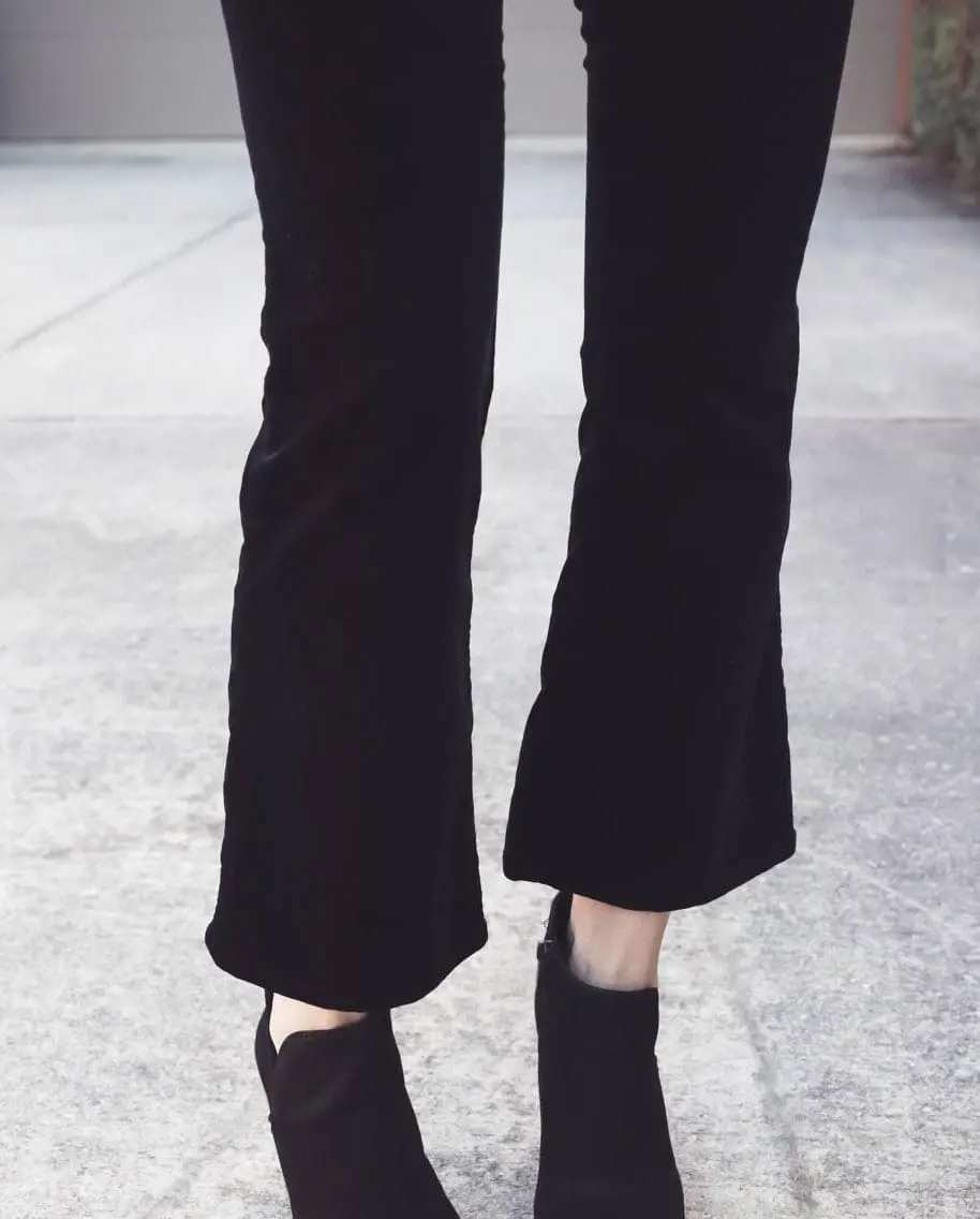 Erin Busbee, fashion blogger and wardrobe stylist from Busbee Style is wearing a Baublebar lariat choker necklace in black paired with a veronica beard scuba blazer and cropped, flared pants by Rag and Bone with Vince Camuto peep toe booties in black. Wear all one color to look longer and taller