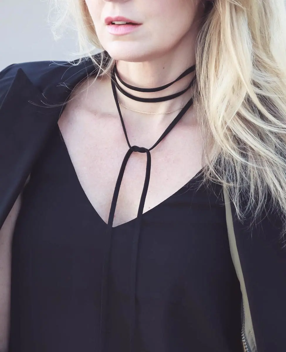 Erin Busbee, fashion blogger and wardrobe stylist from Busbee Style is wearing a Baublebar lariat choker necklace in black paired with a veronica beard scuba blazer and cropped, flared pants by Rag and Bone with Vince Camuto peep toe booties in black. Wear all one color to look longer and taller