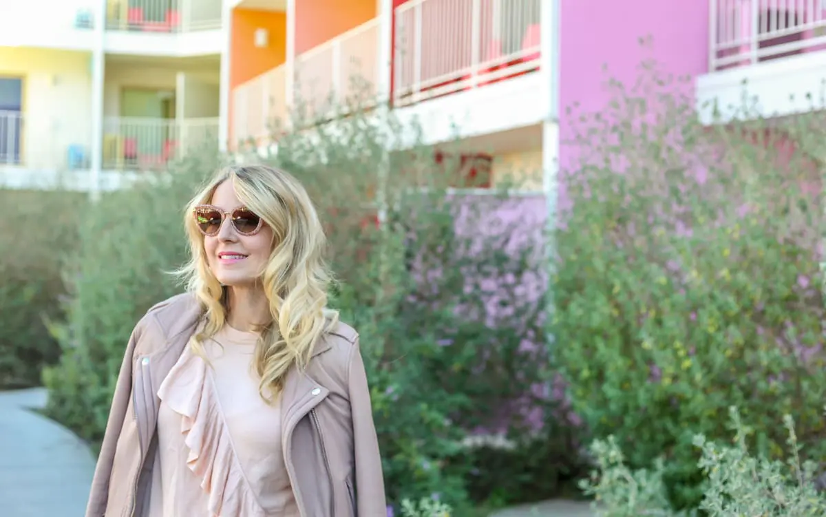 Ruffles - this ruffled sweater by topshop is so feminine and pretty in this blush tone paired with the pink Iro moto jacket and pink sunglasses