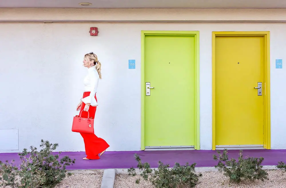 Bright Pants by BCBG really pack a punch... the bold red shade will standout against the chic, white, bell sleeve top from chicwish. I love that 'matching' is back so I was excited to pair this red henri Bendel bag with the pants