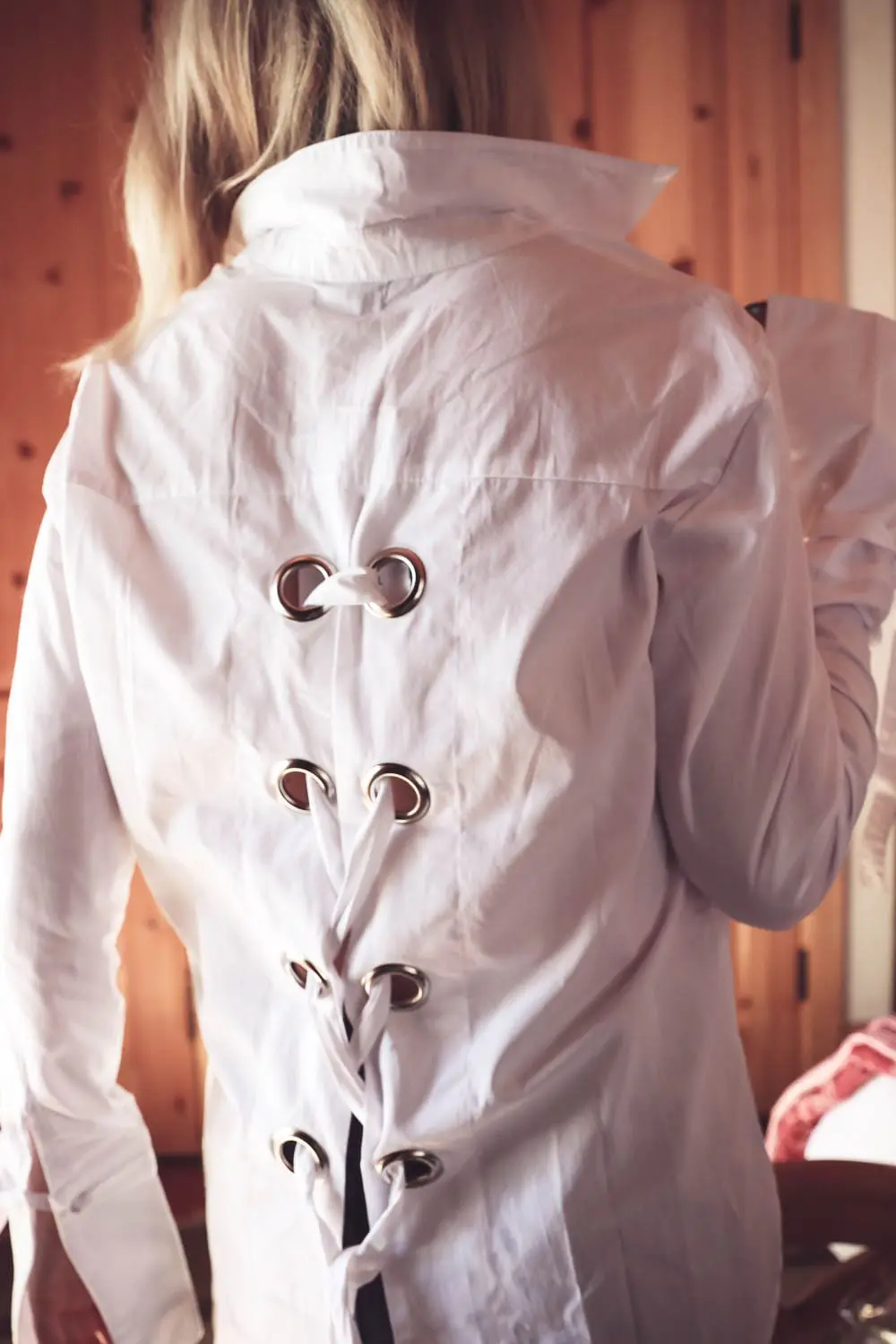 Laceup top by MLM in white button down poplin worn by Erin Busbee, fashion blogger and youtuber based in San Antonio, Texas. The laceup detail is a big fashion trend right now. Look for laceup pumps, flats, jeans, pants, tops, sweaters and jackets!