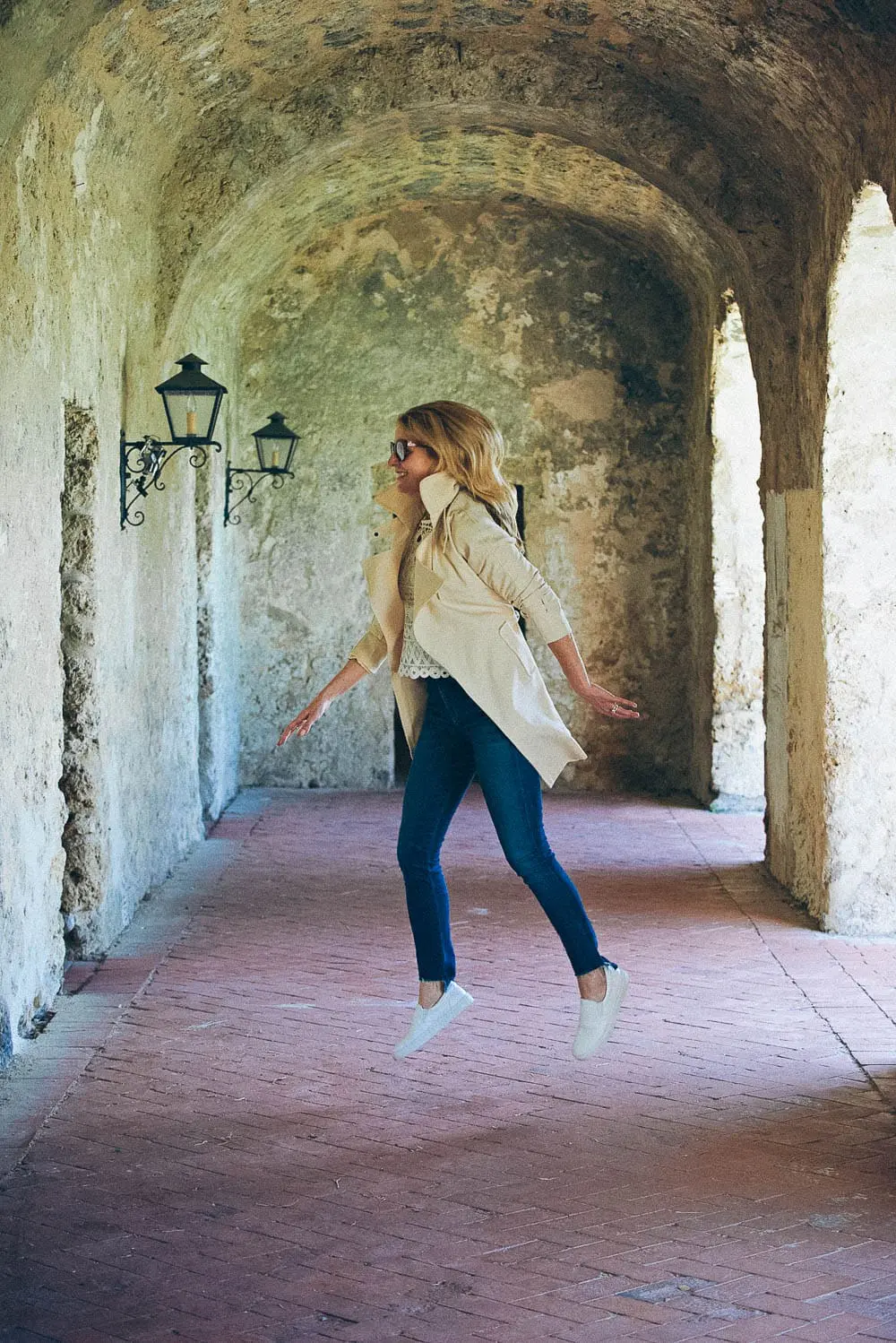 White sneakers slip on by Greats brand, worn 2 ways, including jeans and a one-shoulder top and a beige trench and white eyelet top, featured on Erin Busbee, of BusbeeStyle, fashion blogger and youtuber