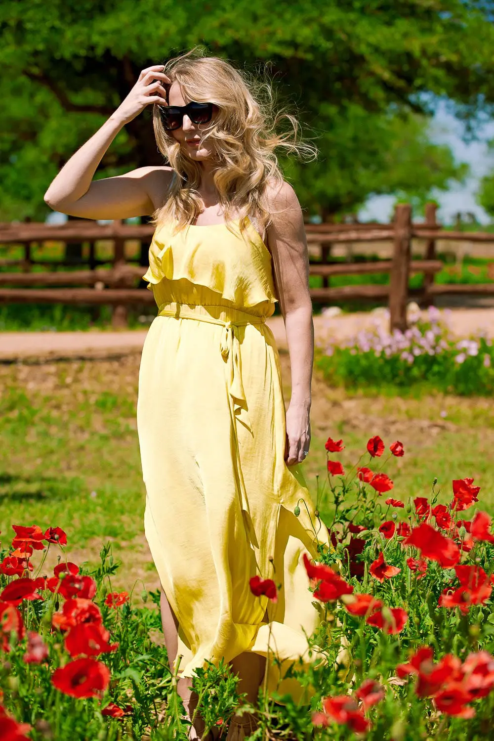 Off shoulder yellow, silky dress by Bardot on fashion blogger and youtuber, Erin Busbee, at Wildseed Farms in Fredericksburg, Texas