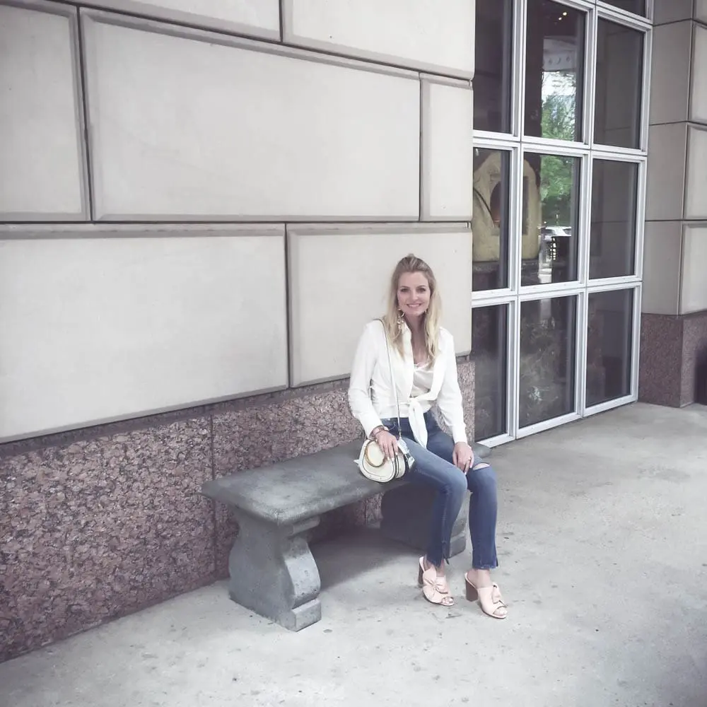 Reward style conference 2017 at hotel crescent court, fashion blogger and fashion youtuber erin busbee wearing norma kamali tie front top, amo denim jeans with twist front, lace cami, mules by avec les filles and chloe nile bracelet bag