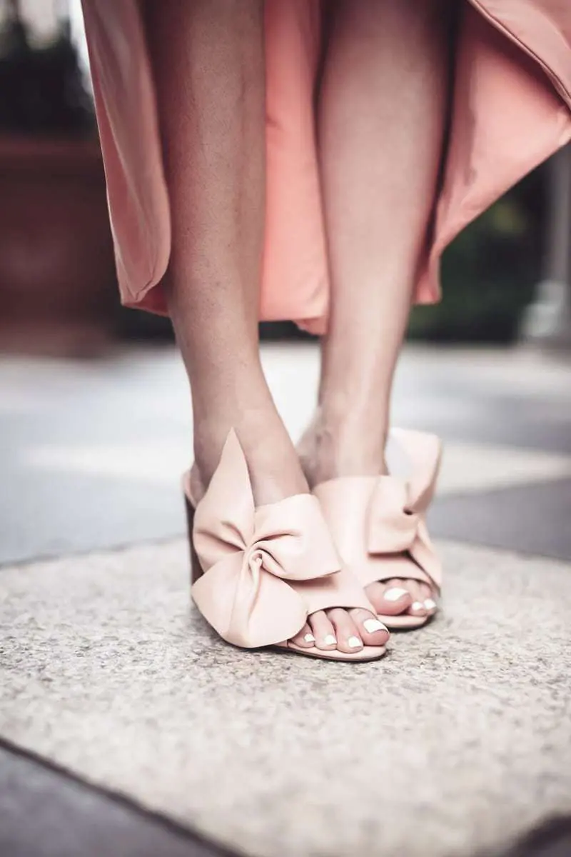 Pink, peach, blush, nude dresses are very much on trend now, I love this Misa wrap dress with the flutter sleeve that I paired with peach bow mules by Avec les filles and the chloe nile bag from Saks Fifth Avenue