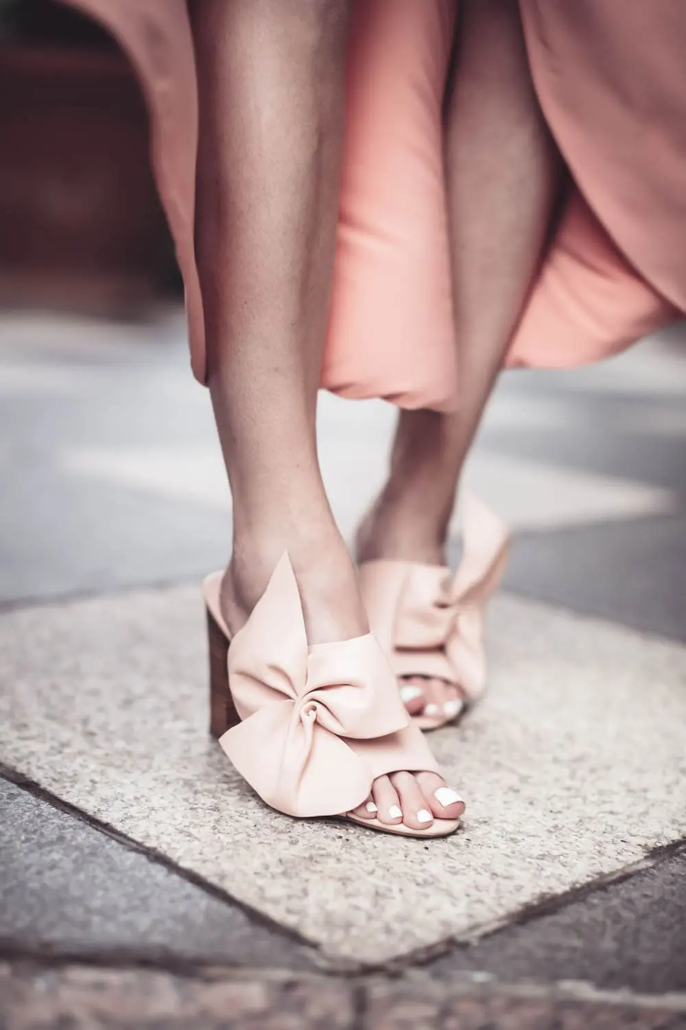 Peach dress by Misa from Revolve Clothing on fashion blogger and youtuber, Erin Busbee, San antonio, Texas, at the Crescent hotel in Dallas for the Reward style conference 