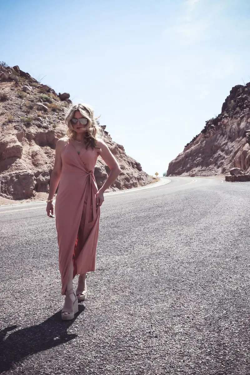 Wrap Dress by Wyldr from Asos and Revolve in blush nude color with Marc Fisher perforated ankle strap espadrilles wedges, on fashion blogger and fashion youtuber erin busbee of busbestyle, san antonio, texas, shot near Big Bend National Park in West Texas along the Rio Grande, super sexy dress idea for women over 40 