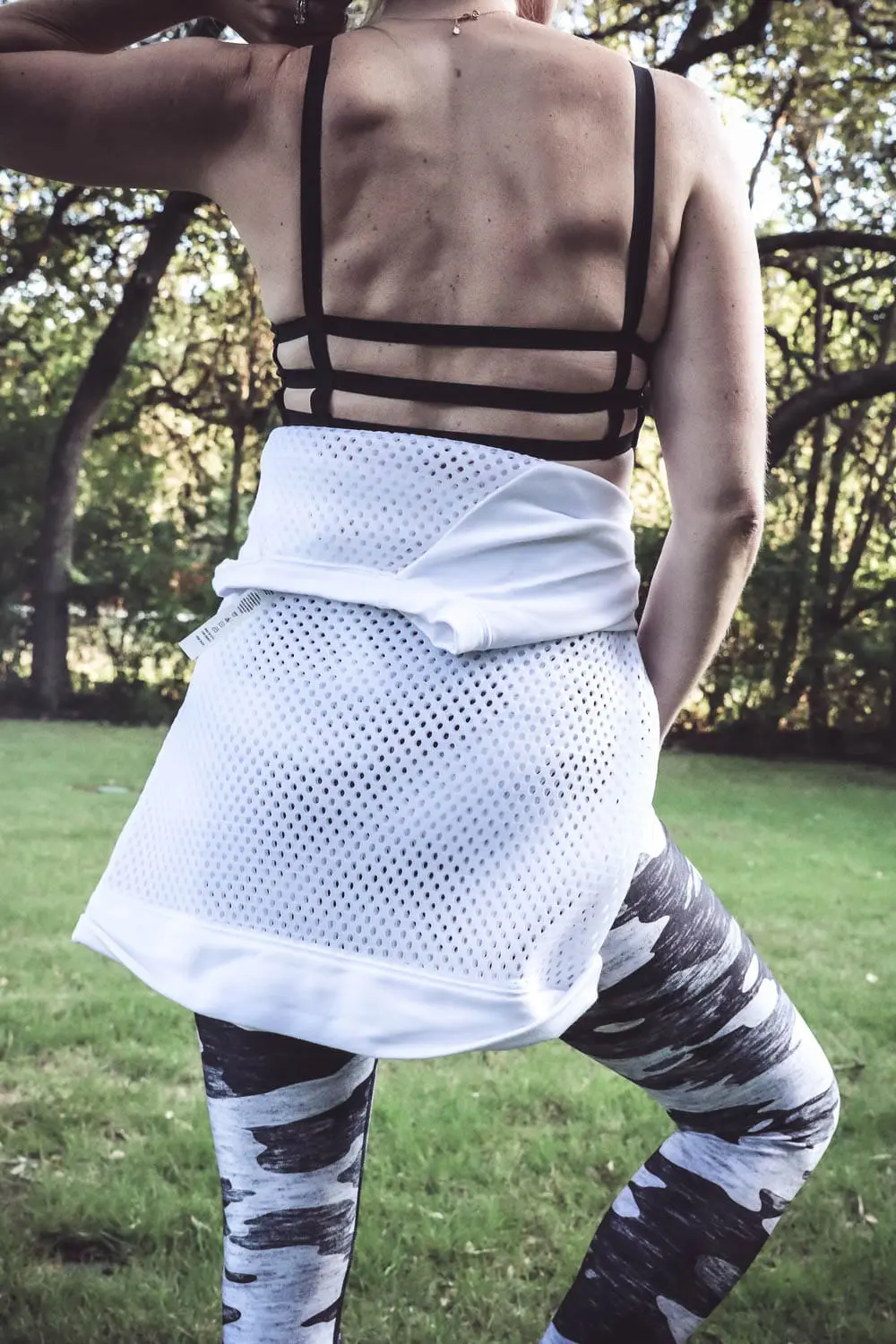 Sexy, edgy, and stylish workout clothes for women over 40, fashion over 40, fashion forward activewear, on Erin Busbee, Busbeestyle.com, fashion blogger and youtuber, look at brands like terez, alo yoga, beyond yoga-scrappy-sports-bra