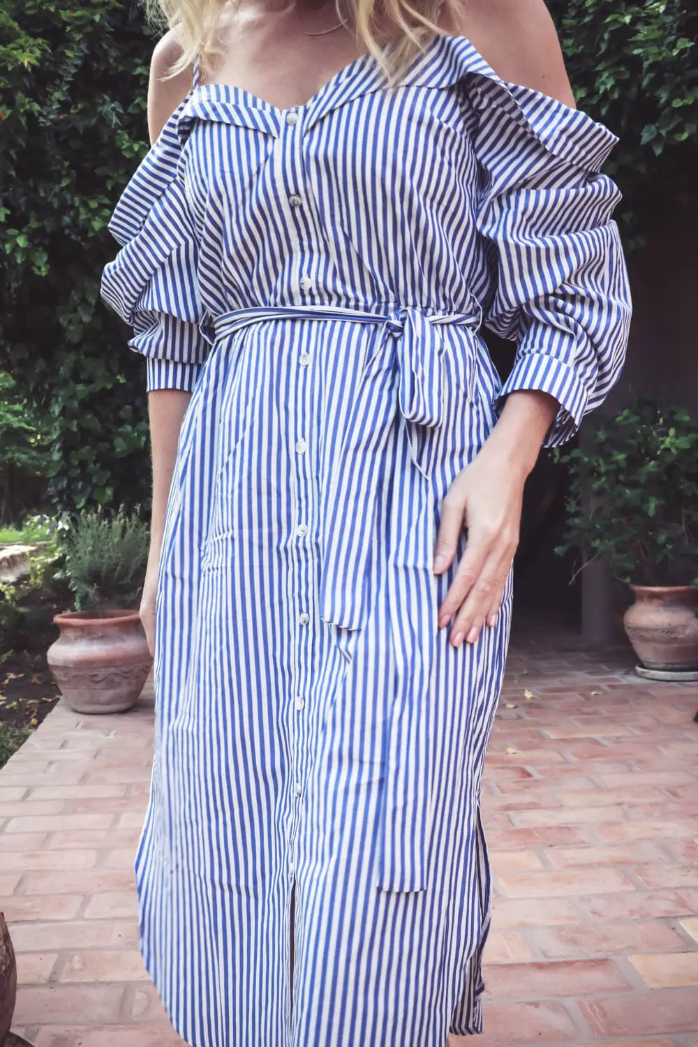 cold shoulder trend, exposed shoulder shirt dress by Bardot in blue and white stripes, paired with marc fisher wedges, quay mirrored sunglasses on fashion blogger and youtuber over 40, erin busbee