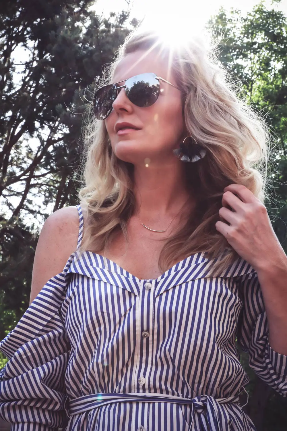 cold shoulder trend, exposed shoulder shirt dress by Bardot in blue and white stripes, paired with marc fisher wedges, quay mirrored sunglasses on fashion blogger and youtuber over 40, erin busbee