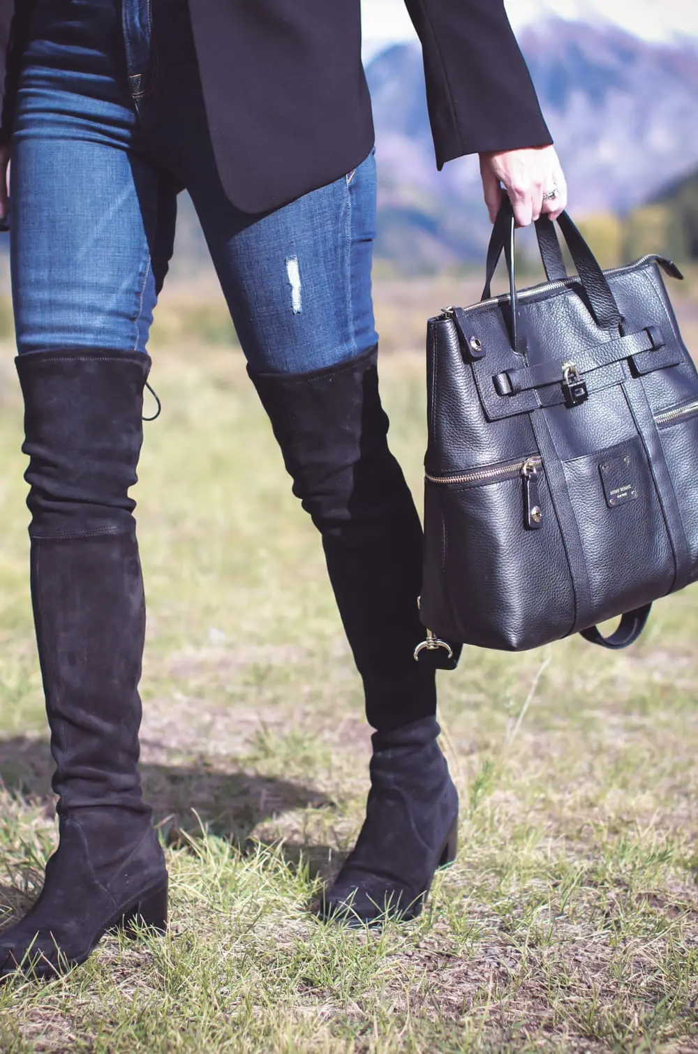 Tall Boots, over the knee boots, how to wear otk boots if you are tall or petite, featuring fashion blogger, Erin Busbee of Busbee Style in Telluride, Colorado, wearing Stuart Weitzman lowland boots , carrying Henri Bendel Jetsetter backpack