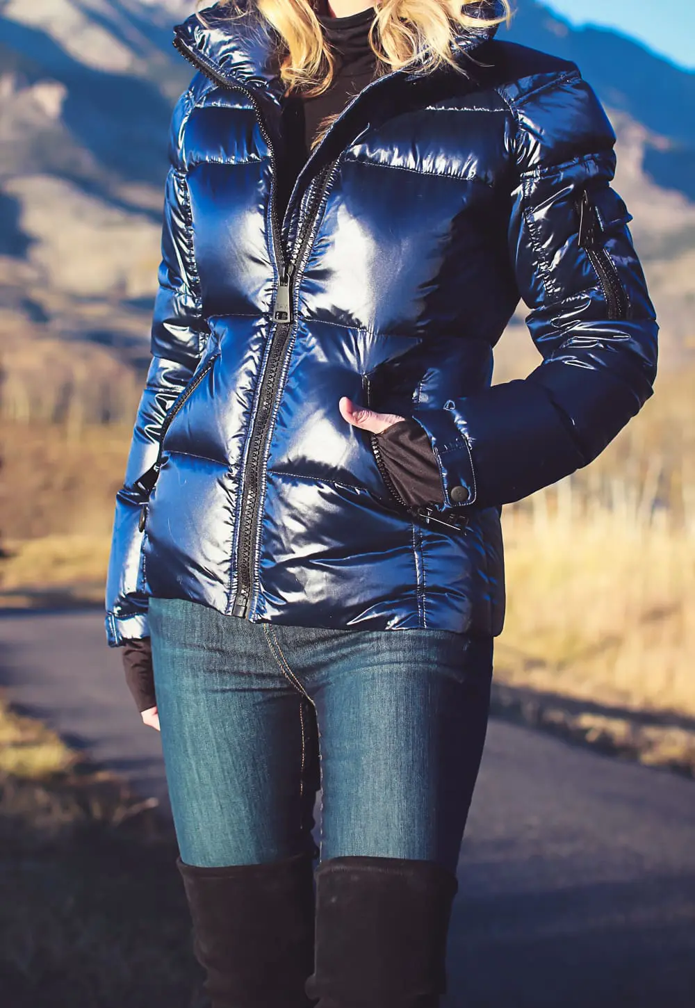Black turtleneck with SAM. puffer jacket from Bloomingdales and Stuart Weitzman Lowland Boots