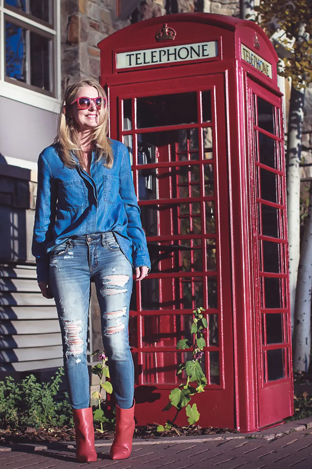 How to wear red boots, red booties by Dolce Vita with denim on denim look, on fashion blogger over 40, Erin Busbee of Busbee Style in Mountain Village, Colorado