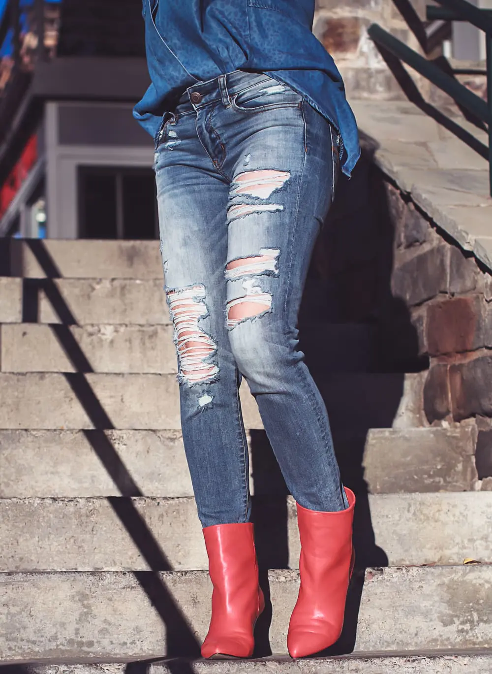 How to wear red boots, red booties by Dolce Vita with denim on denim look, American Eagle jeans, Bella Dahl chambray shirt, on fashion blogger over 40, Erin Busbee of Busbee Style in Mountain Village, Colorado