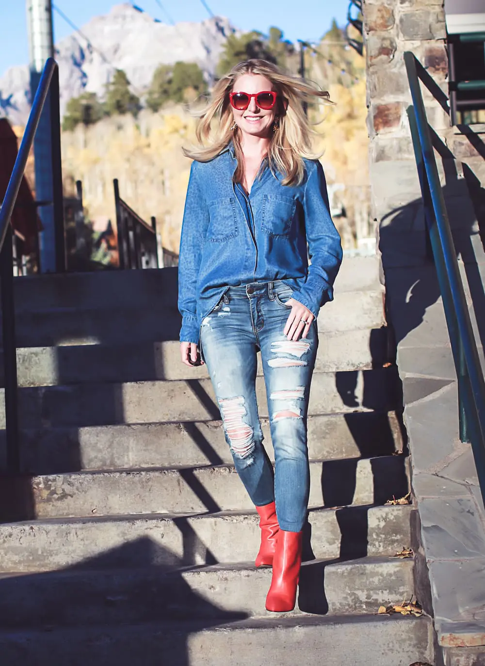 How to wear red boots, red booties by Dolce Vita with denim on denim look, American Eagle jeans, Bella Dahl chambray shirt, on fashion blogger over 40, Erin Busbee of Busbee Style in Mountain Village, Colorado