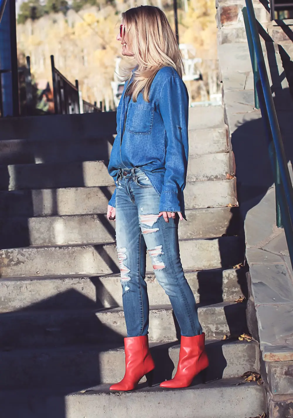 How to wear red boots, red booties by Dolce Vita with denim on denim look, American Eagle jeans, Bella Dahl chambray shirt, on fashion blogger over 40, Erin Busbee of Busbee Style in Mountain Village, Colorado