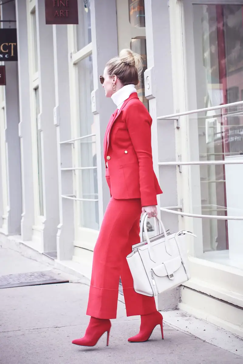 How to wear red from head to toe featuring fashion blogger over 40, Erin Busbee of Busbee Style in Telluride, Colorado wearing a Smythe suit and Steven Madden sock booties