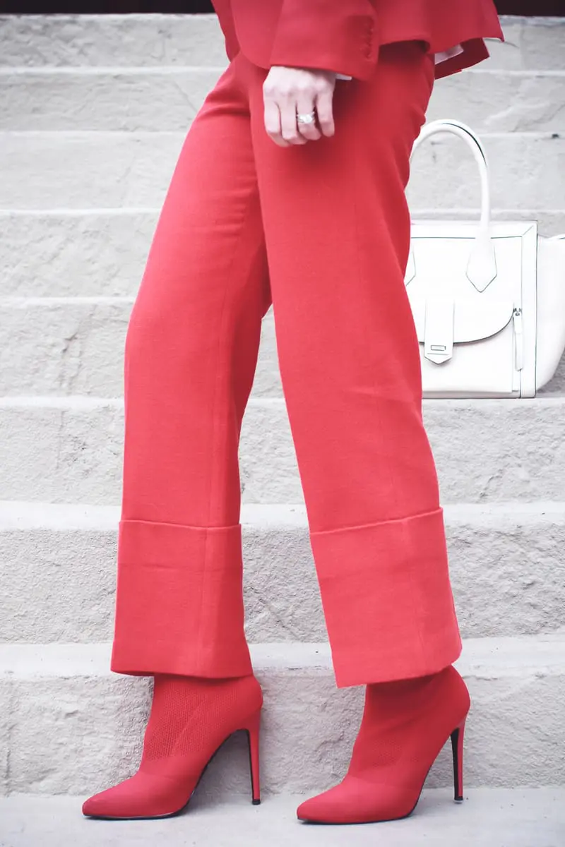 How to wear red from head to toe featuring fashion blogger over 40, Erin Busbee of Busbee Style in Telluride, Colorado wearing a Smythe suit and Steven Madden sock booties