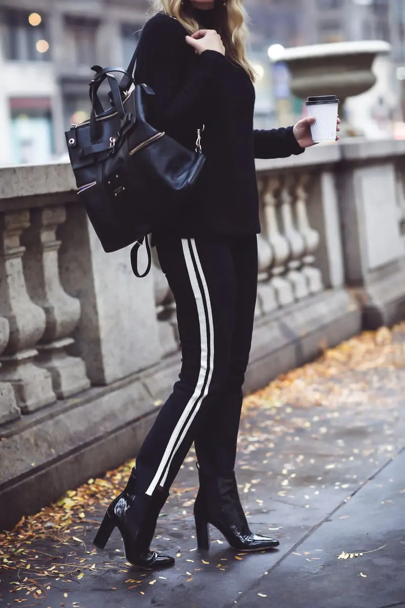 Beret, how to style a beret, how to look french, Erin Busbee of Busbee Style, fashion blogger over 40, walking in NYC with her black beret and all black look including Mother striped jeans, vince camuto patent booties and aqua cashmere choker sweater