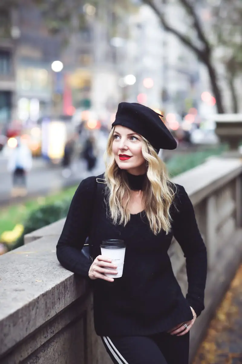 Beret, how to style a beret, how to look french, Erin Busbee of Busbee Style, fashion blogger over 40, walking in NYC with her black beret and all black look including Mother striped jeans, vince camuto patent booties and aqua cashmere choker sweater