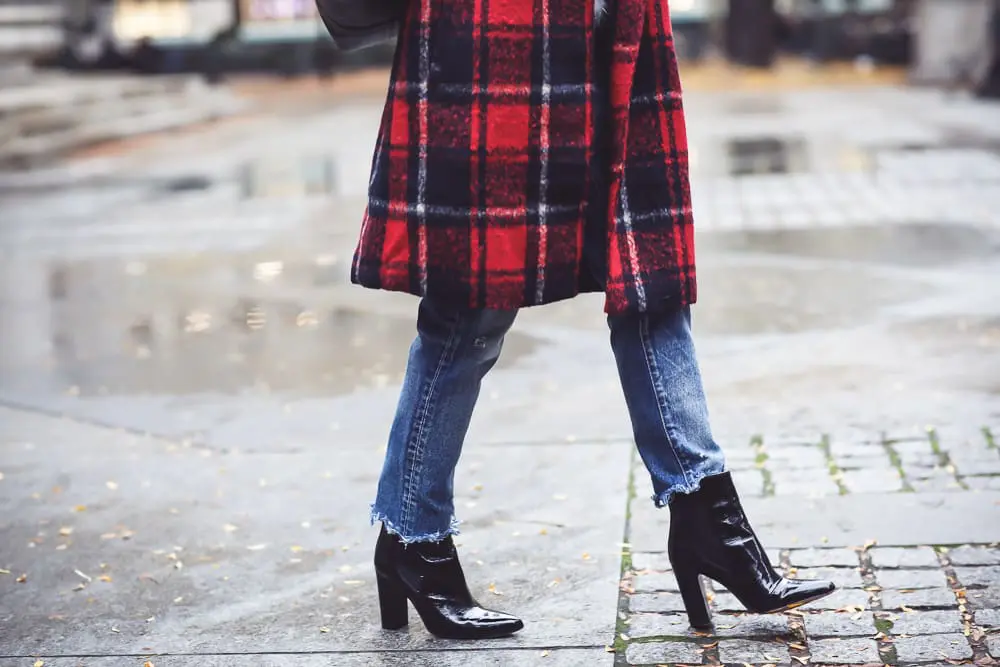 Plaid coat by cupcakes and cashmere in red and navy, with Moussy Jeans, fuzzy white sweater from Bloomingdales, and black patent britsy boots on fashion blogger, Erin Busbee from Busbee Style by NYC public library
