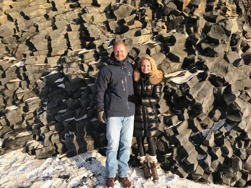 Planning a trip to Iceland | Reynisfjara Beach in Vix, basalt columns Erin Busbee of Busbee Style and her husband Chris, what to wear and what to pack