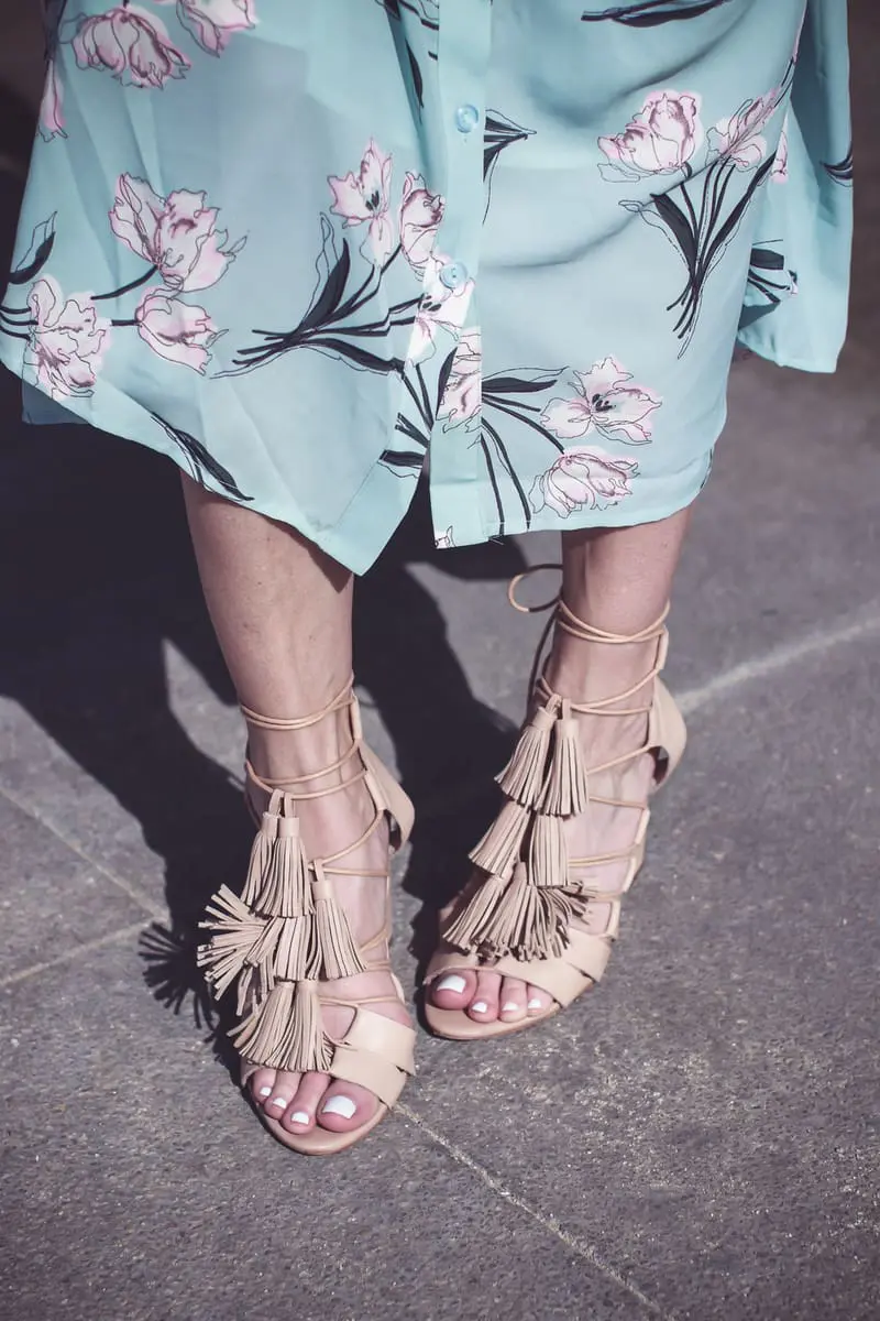 Beach shoes, on fashion blogger Erin Busbee of Busbee Style, Fashion over 40, wearing a floral print maxi dress in mint green, wearing Loeffler Randall laceup tassel sandals in nude in Cabo San Lucas