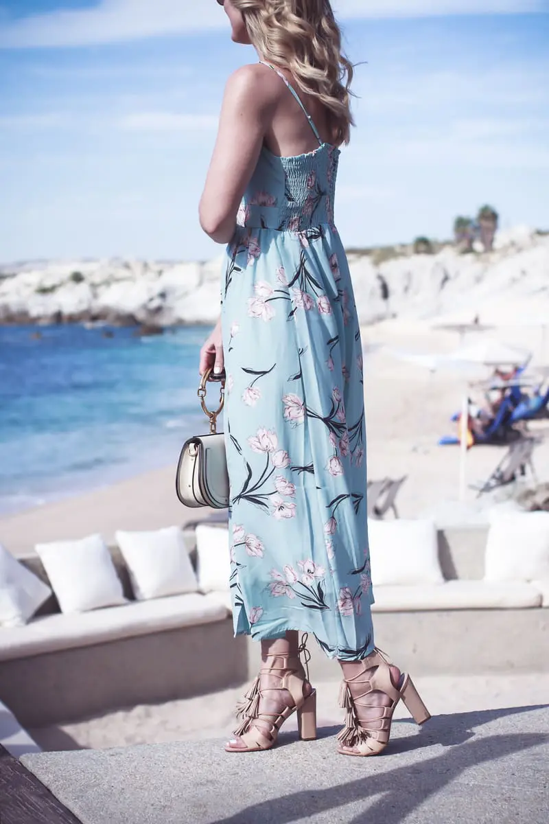 Beach shoes, on fashion blogger Erin Busbee of Busbee Style, Fashion over 40, wearing a floral print maxi dress in mint green, wearing Loeffler Randall laceup tassel sandals in nude in Cabo San Lucas