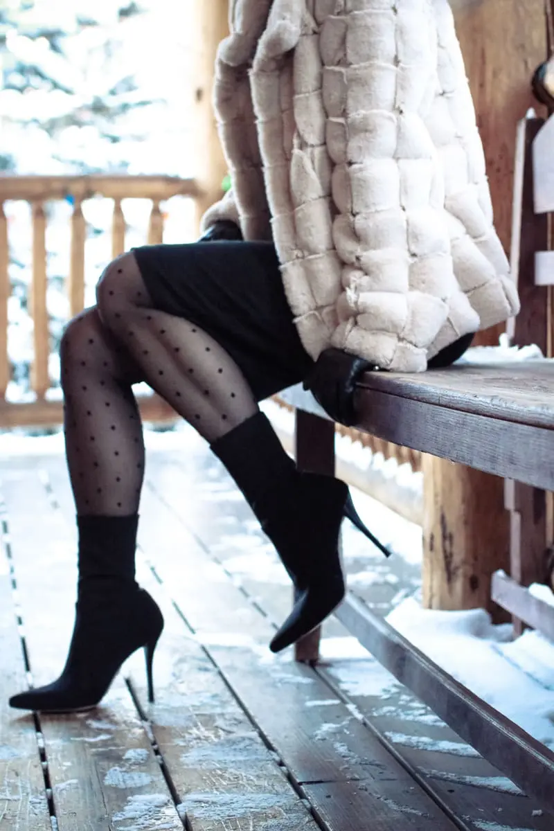 essential winter boots, featuring a dressy sock ankle bootie in black by Stuart Weitzman paired with a T by Alexander Wang laceup dress, and a faux fur coat by Kristin Blake on fashion blogger over 40, Erin Busbee of Busbee Style