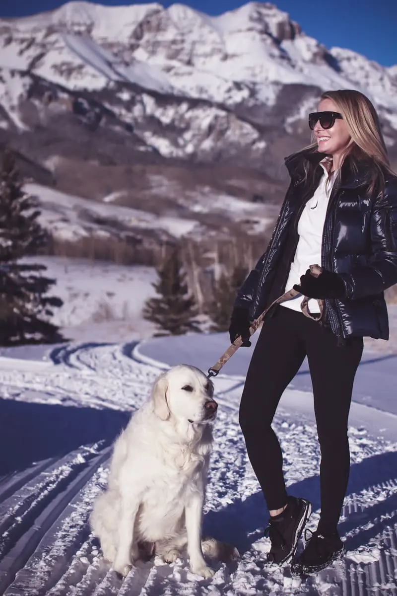 Fitness routine update, featuring activewear from eBay, SAM. New York puffer in midnight blue, black workout vest, white fleece pullover by Northface, and Zella tank on fashion blogger over 40, Erin Busbee, walking her dog
