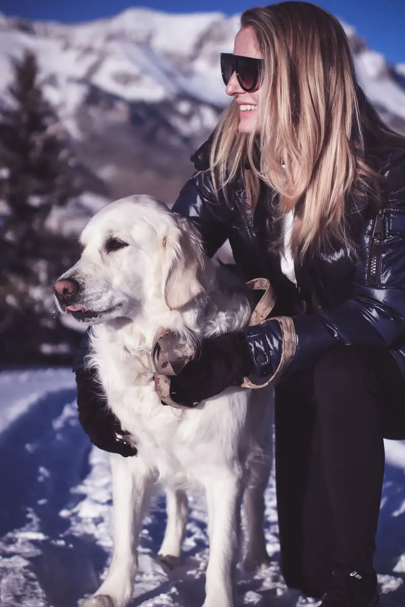 Fitness routine update, featuring activewear from eBay, SAM. New York puffer in midnight blue, black workout vest, white fleece pullover by Northface, and Zella tank on fashion blogger over 40, Erin Busbee, walking her dog, English golden retriever