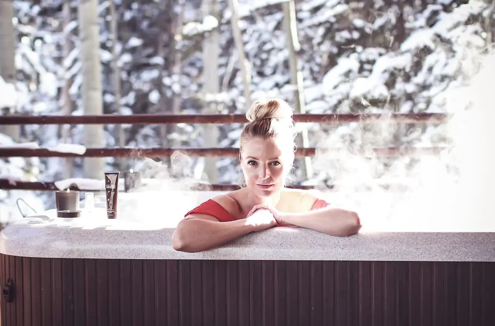Spa day, how to have a spa day at home with lifestyle and beauty blogger over 40, Erin Busbee of BusbeeStyle.com, in steaming hot tub in Telluride Colorado