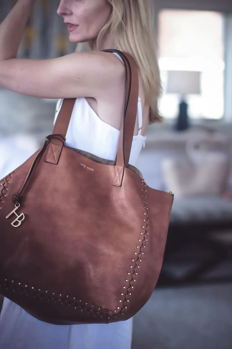 Best accessories featuring a saddle slouchy tote oversized from Henri Bendel on fashion blogger Erin Busbee over 40 of Busbee Style